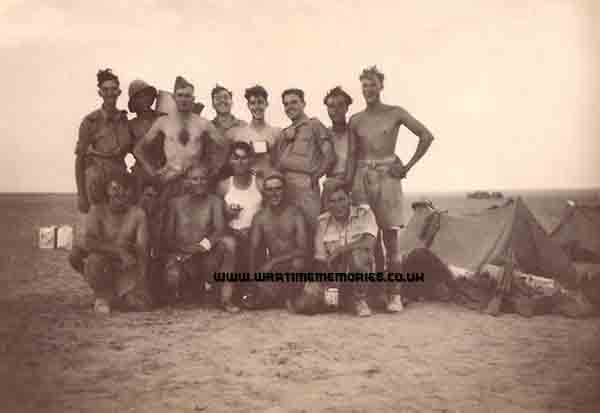 9RB's Tobruk, 1942, 1st Right Johnny Smith 3rd Right, Albert Drew 4th Right Fred Pinner